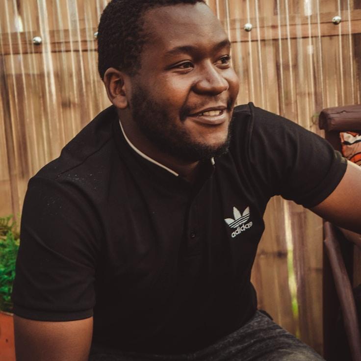 Alex Reed, Lead Design Curator at Crystal Veri Dynamics, reviewing corporate floral arrangements